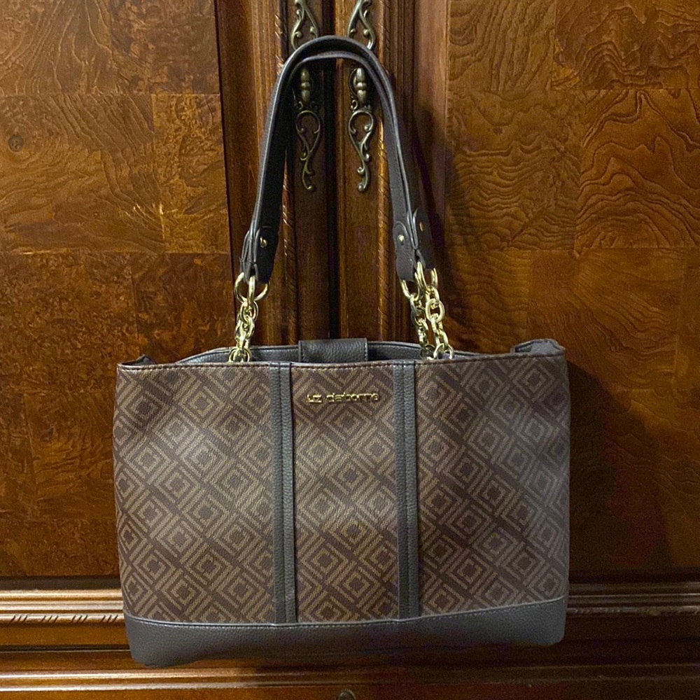 Brand new never used Liz Claiborne hand bag. Brown with gold hardware.